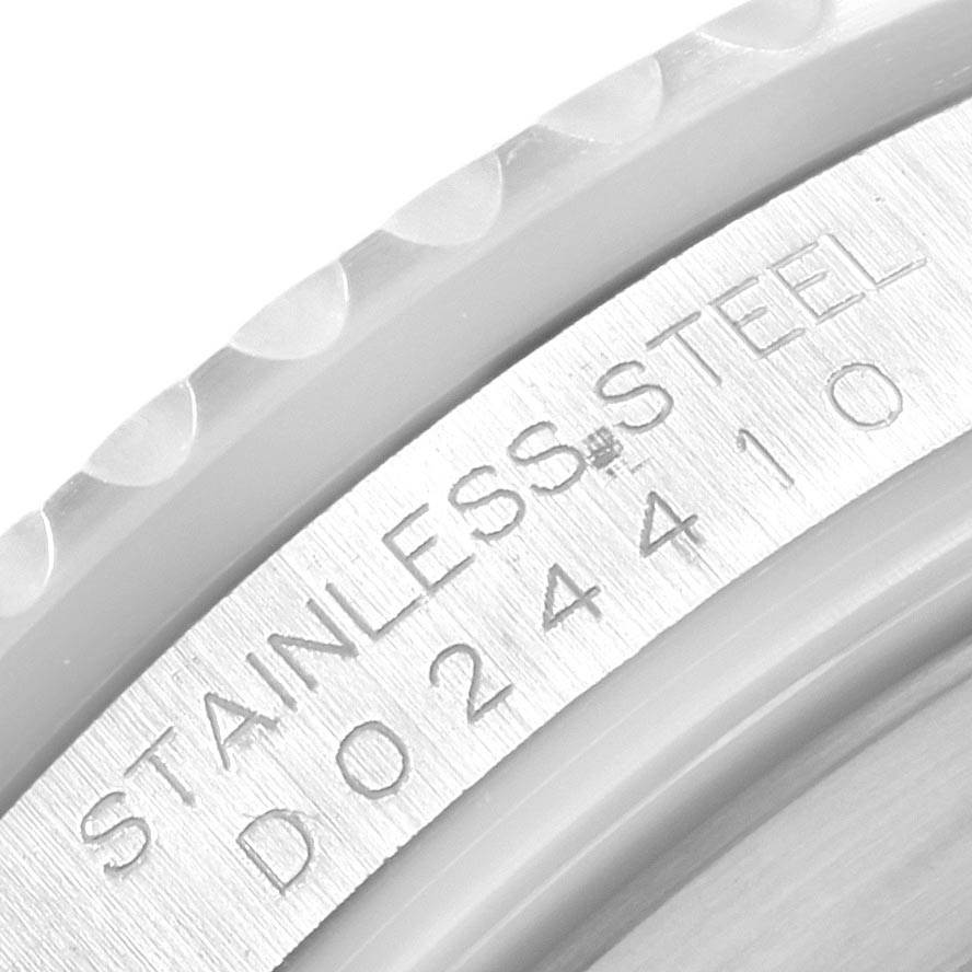 This close-up image shows the engraved serial number and "Stainless Steel" text on the Rolex Submariner 16610 Men's Stainless Steel Black Dial 16610 Men's Stainless Steel Black Dial model's case.