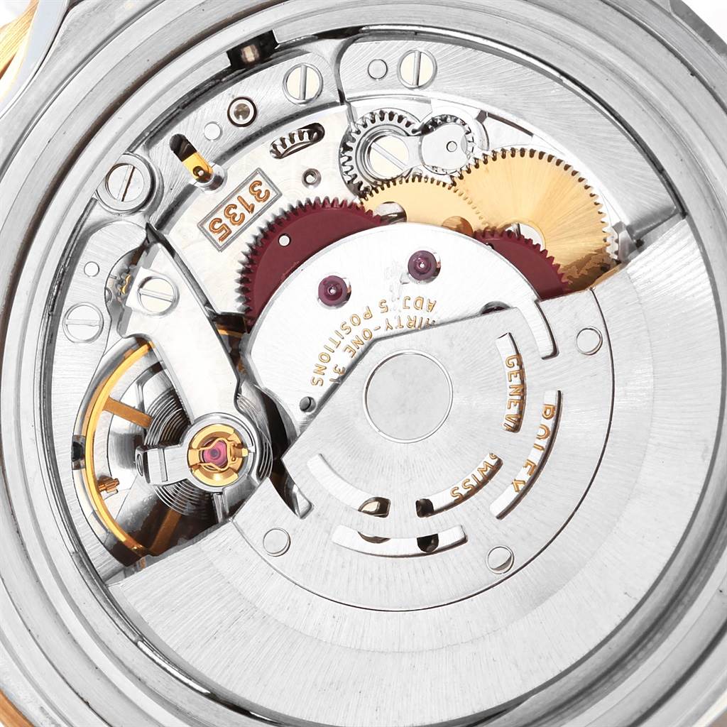 The image shows the intricate internal movement parts of a Rolex Submariner 16613 Men's Steel and Gold (two tone) Black Dial 16613 Men's Steel and Gold (two tone) Black Dial watch from a close-up top-down view.