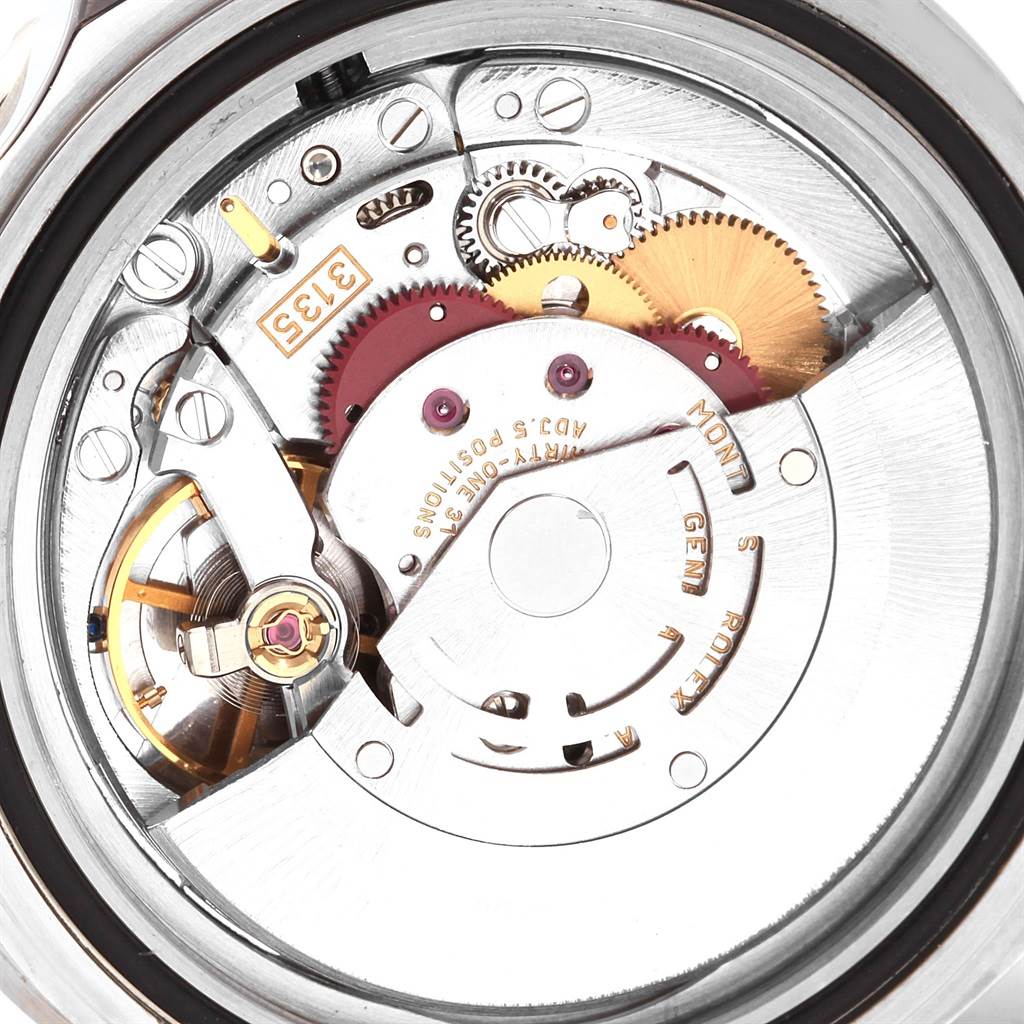 This image shows a close-up view of the internal mechanical movement of a Rolex Submariner 16610 Men's Stainless Steel Black Dial 16610 Men's Stainless Steel Black Dial watch.