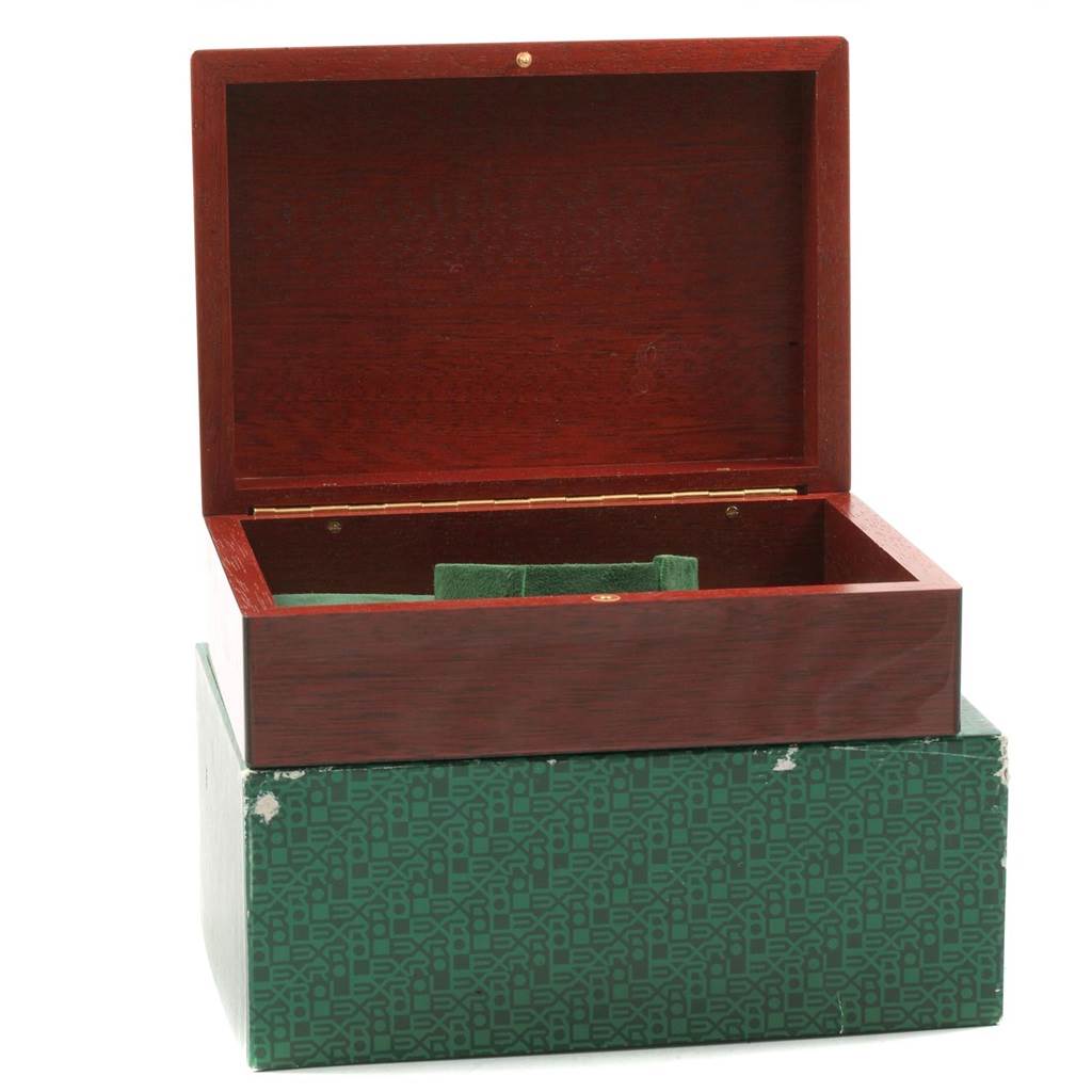 The image shows an open wooden box and a green patterned cardboard box for the Rolex Submariner 16618 Men's Yellow Gold Blue Dial 16618 Men's Yellow Gold Blue Dial watch.