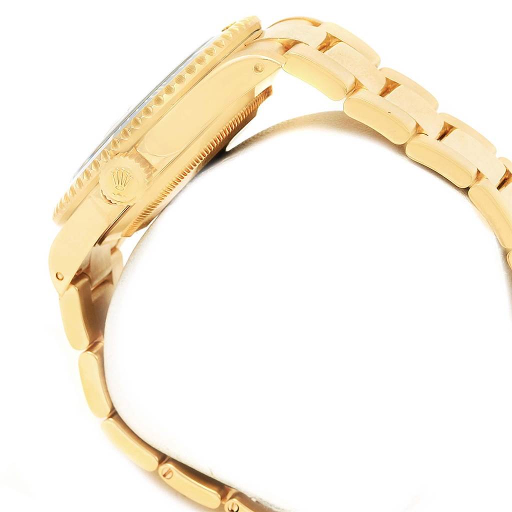 The image shows a side view of the Rolex Submariner 16618 Men's Yellow Gold Blue Dial 16618 Men's Yellow Gold Blue Dial watch, highlighting the crown, case, and bracelet.