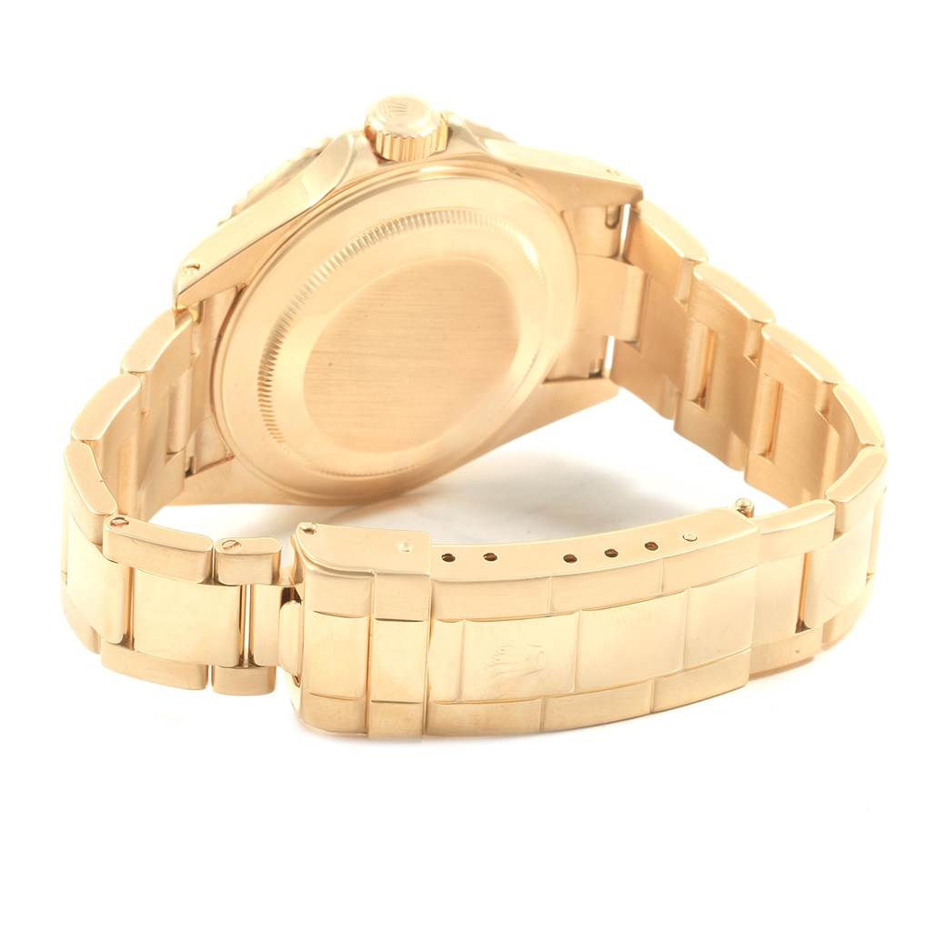 The image shows the back view and bracelet of a Rolex Submariner 16618 Men's Yellow Gold Blue Dial 16618 Men's Yellow Gold Blue Dial watch in gold.