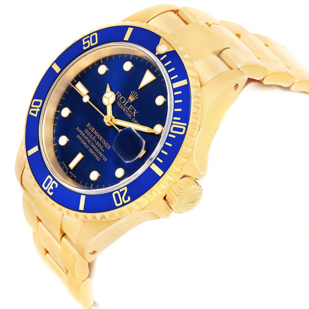 The image shows a close-up angle of the Rolex Submariner 16618 Men's Yellow Gold Blue Dial 16618 Men's Yellow Gold Blue Dial watch, highlighting its blue dial, bezel, and gold case and bracelet.