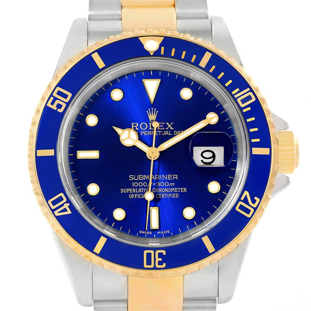 The image shows a frontal view of a Rolex Submariner 16613 Men's Steel and Gold (two tone) Blue Dial 16613 Men's Steel and Gold (two tone) Blue Dial watch with a blue dial and bezel, gold accents, and the date display.