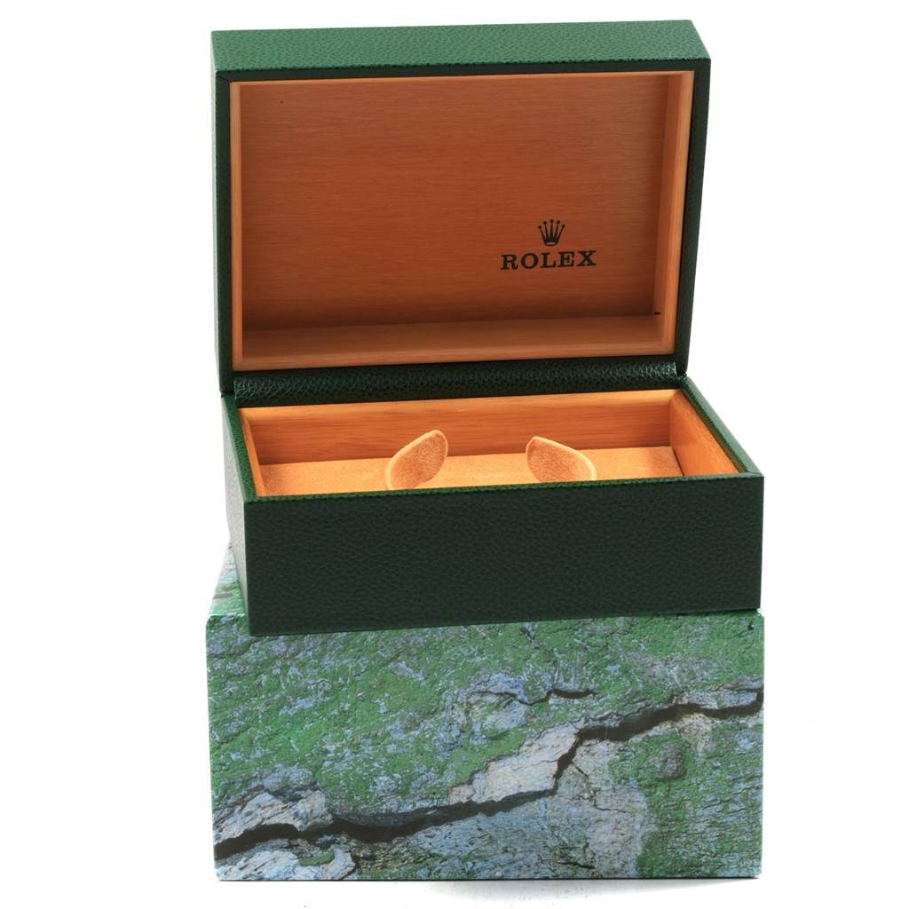 This image shows an open green box for a Rolex Submariner 14060 Men's Stainless Steel Black Dial 14060 Men's Stainless Steel Black Dial watch, with the inner wooden compartment and cushion pads visible.