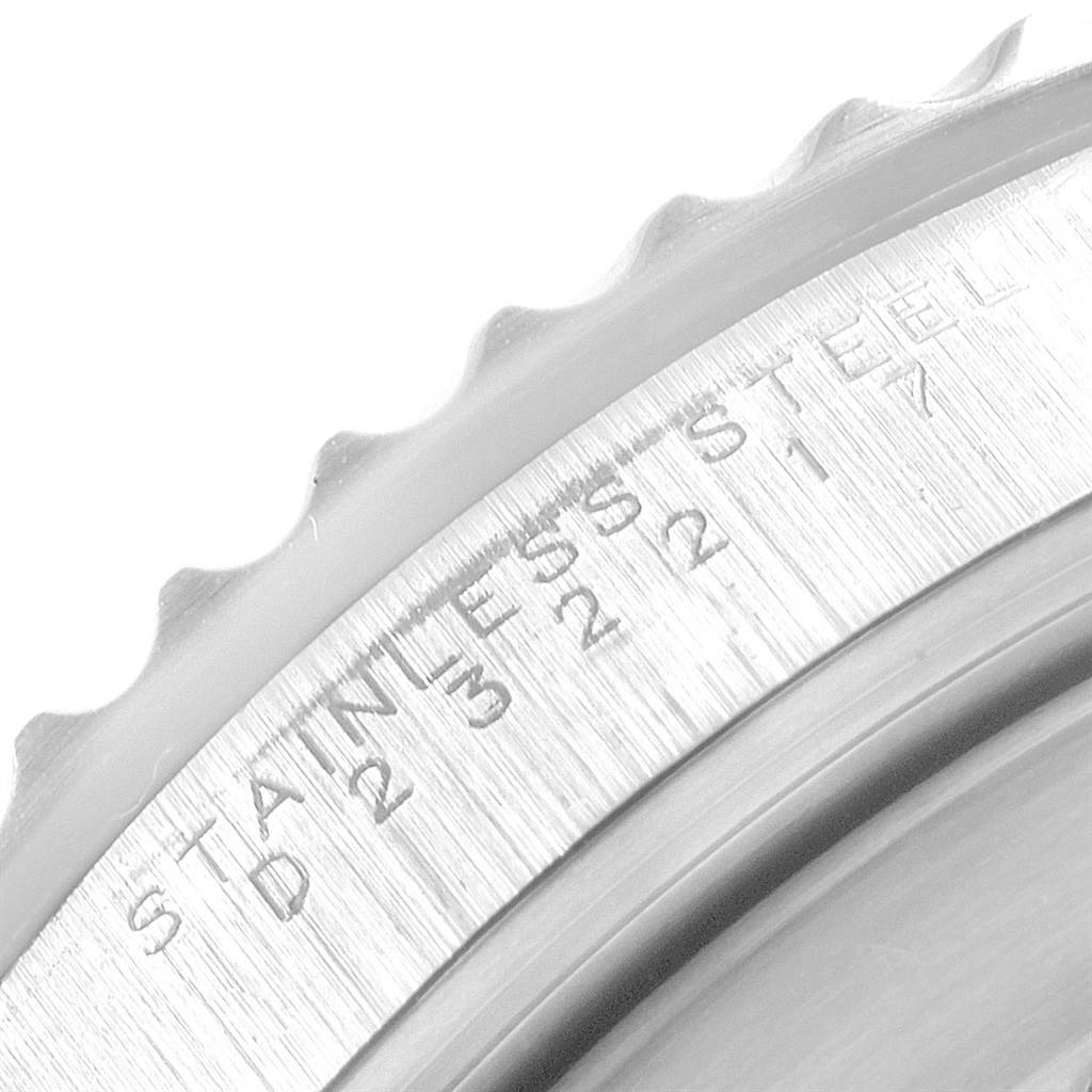 This close-up shows the engraved outer edge of the bezel of the Rolex Submariner 14060 Men's Stainless Steel Black Dial 14060 Men's Stainless Steel Black Dial watch.