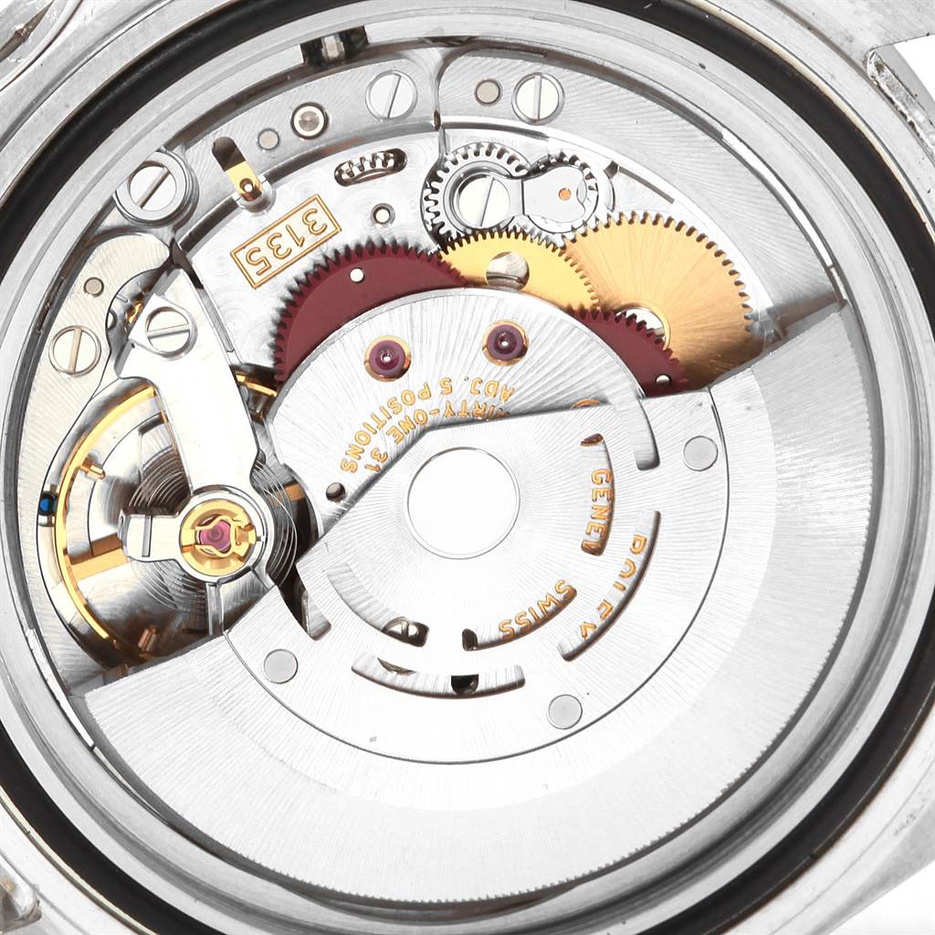 This image shows the movement mechanism of a Rolex Submariner 16610 Men's Stainless Steel Black Dial 16610 Men's Stainless Steel Black Dial watch from a macro angle.