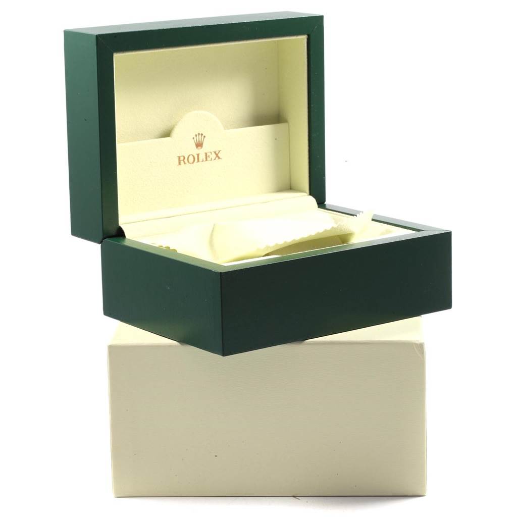 The image shows an open green Rolex box meant for the Submariner model, displaying the interior and cushioning.