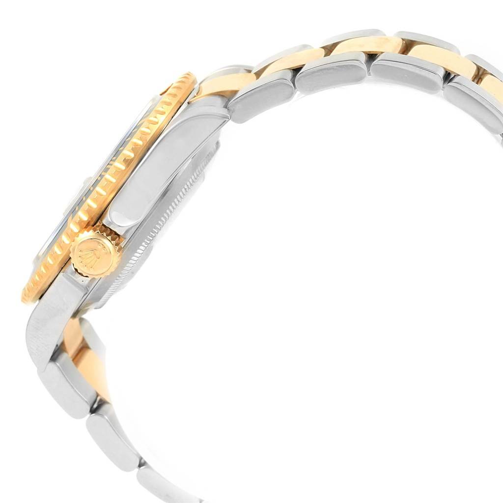 The image shows the side view of the Rolex Submariner 16613 Men's Steel and Gold (two tone) Black Dial 16613 Men's Steel and Gold (two tone) Black Dial watch, including part of its bracelet and the crown.