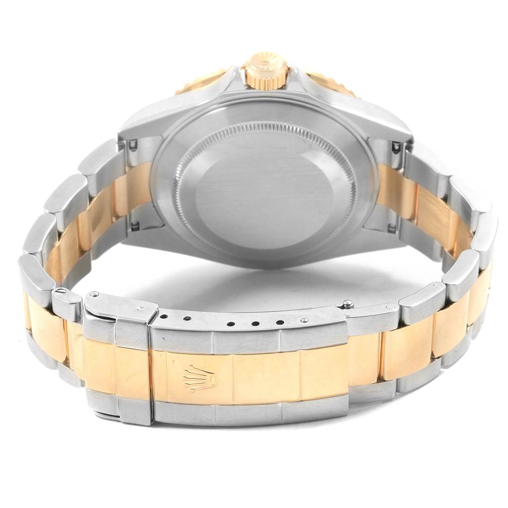 The image shows a rear view of the Rolex Submariner 16613 Men's Steel and Gold (two tone) Black Dial 16613 Men's Steel and Gold (two tone) Black Dial, highlighting its bracelet, case back, and clasp.