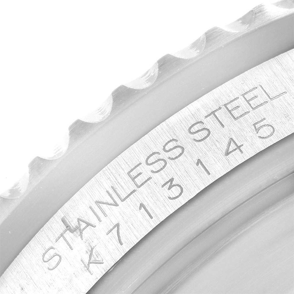 This image shows a close-up of the stainless steel outer edge and bezel teeth of the Rolex Submariner 16610 Men's Stainless Steel Black Dial 16610 Men's Stainless Steel Black Dial watch.