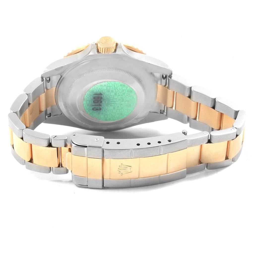 This image shows the back view of a Rolex Submariner 16613 Men's Steel and Gold (two tone) Blue Dial 16613 Men's Steel and Gold (two tone) Blue Dial watch, highlighting its two-tone bracelet and clasp.