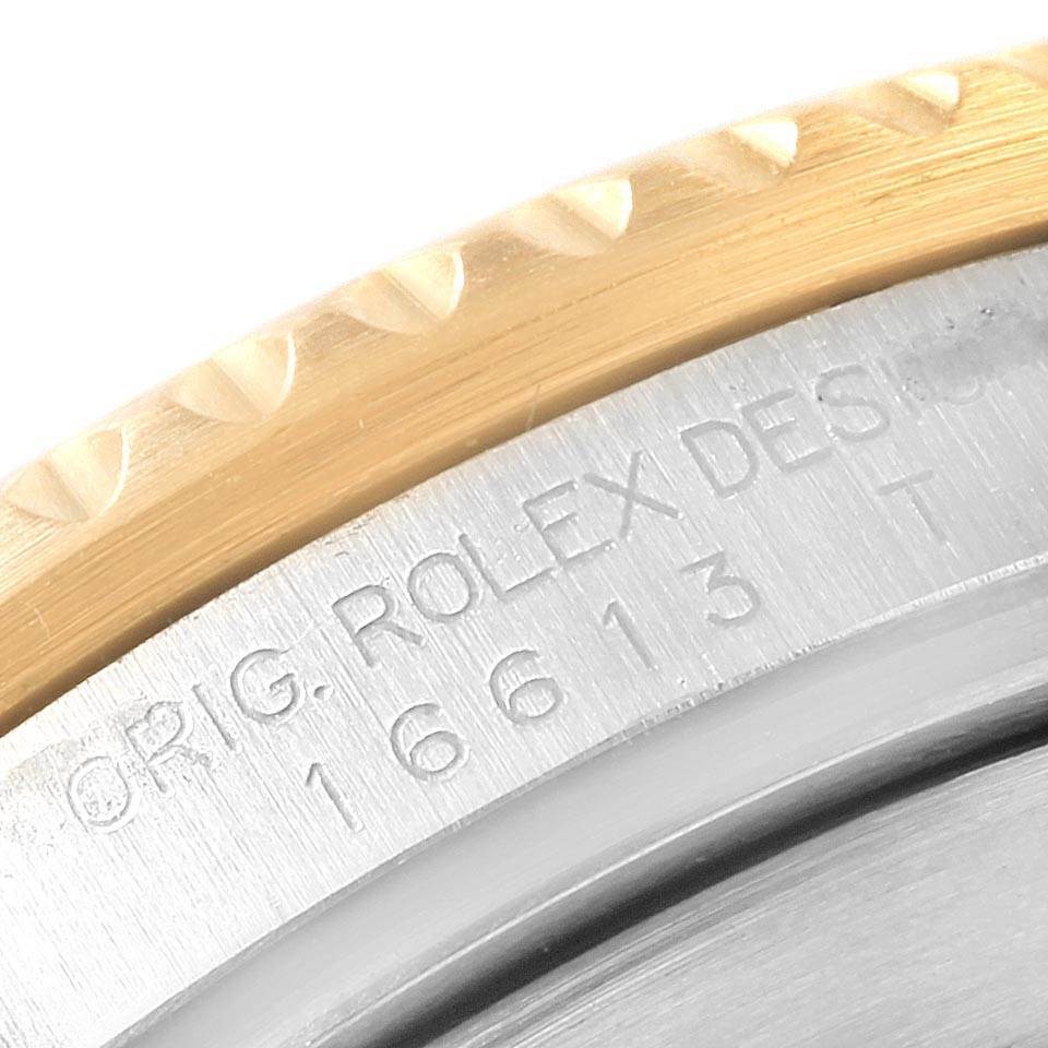 This image shows a close-up of the bezel and case back of a Rolex Submariner 16613 Men's Steel and Gold (two tone) Blue Dial 16613 Men's Steel and Gold (two tone) Blue Dial watch, highlighting its reference number 16613.