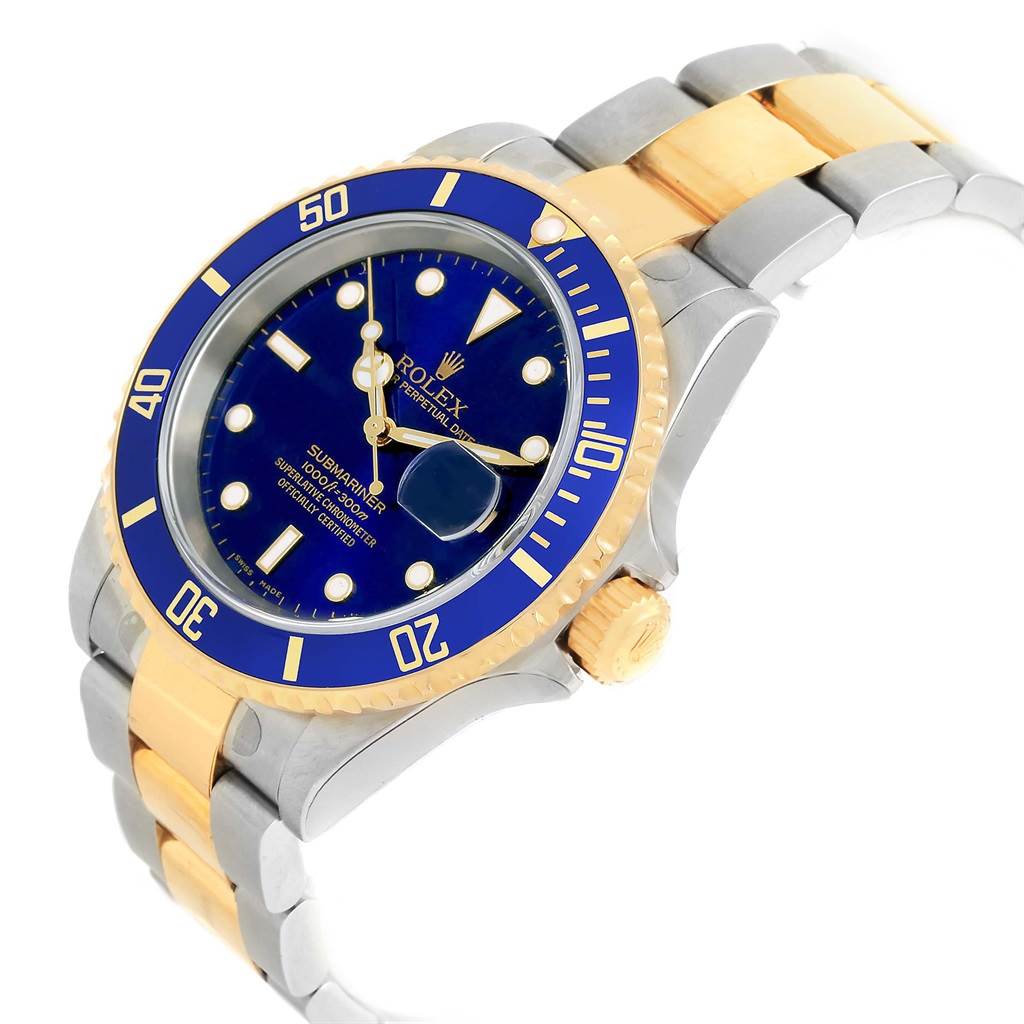 This image shows a Rolex Submariner 16613 Men's Steel and Gold (two tone) Blue Dial 16613 Men's Steel and Gold (two tone) Blue Dial watch at an angle, highlighting its blue dial, gold bezel, and two-tone metal band.
