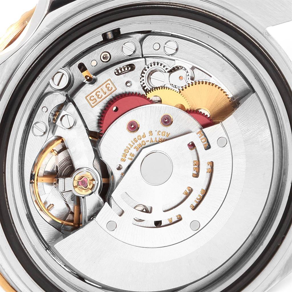This image shows a close-up view of the movement mechanism of a Rolex Submariner 16613 Men's Steel and Gold (two tone) Black Dial 16613 Men's Steel and Gold (two tone) Black Dial watch.