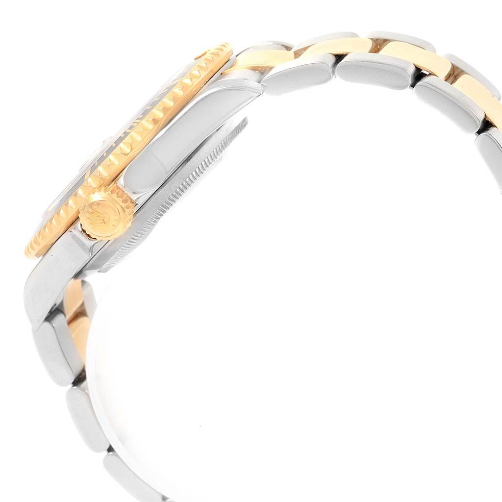 The image shows a side view of a Rolex Submariner 16613 Men's Steel and Gold (two tone) Black Dial 16613 Men's Steel and Gold (two tone) Black Dial's bezel, crown, and part of the bracelet.