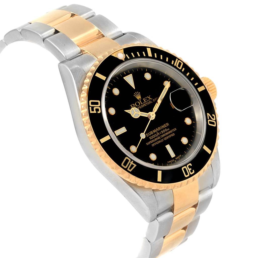 This image shows a Rolex Submariner 16613 Men's Steel and Gold (two tone) Black Dial 16613 Men's Steel and Gold (two tone) Black Dial watch from a slight angle, displaying its dial, bezel, and two-tone metal bracelet.