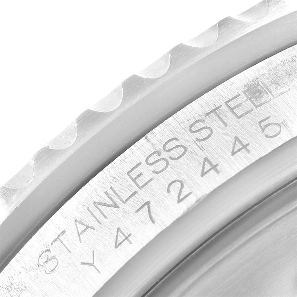 This close-up image shows the stainless steel bezel and engraved writing on the side of the Rolex Submariner 16610 Men's Stainless Steel Black Dial 16610 Men's Stainless Steel Black Dial.