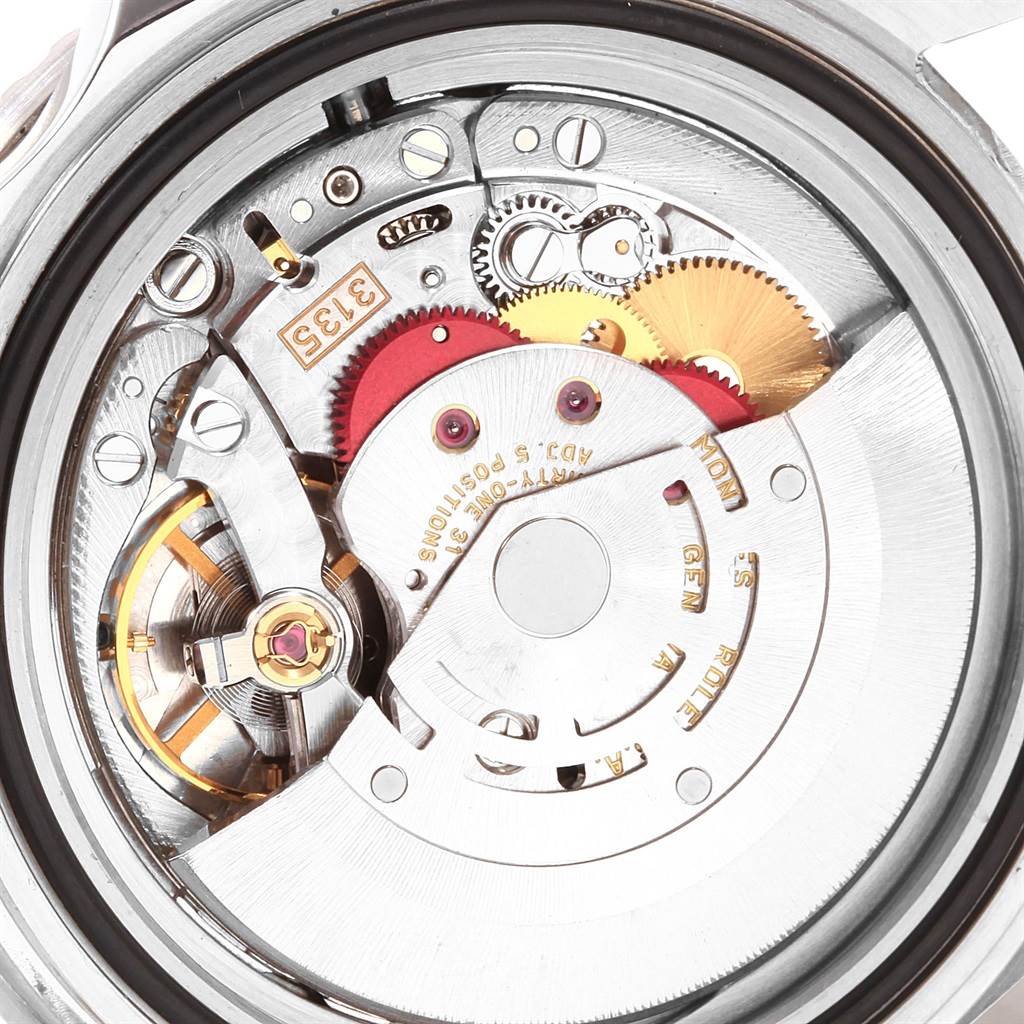 This image shows the internal mechanical movement of a Rolex Submariner 16610 Men's Stainless Steel Black Dial 16610 Men's Stainless Steel Black Dial, focusing on its gears and rotor.