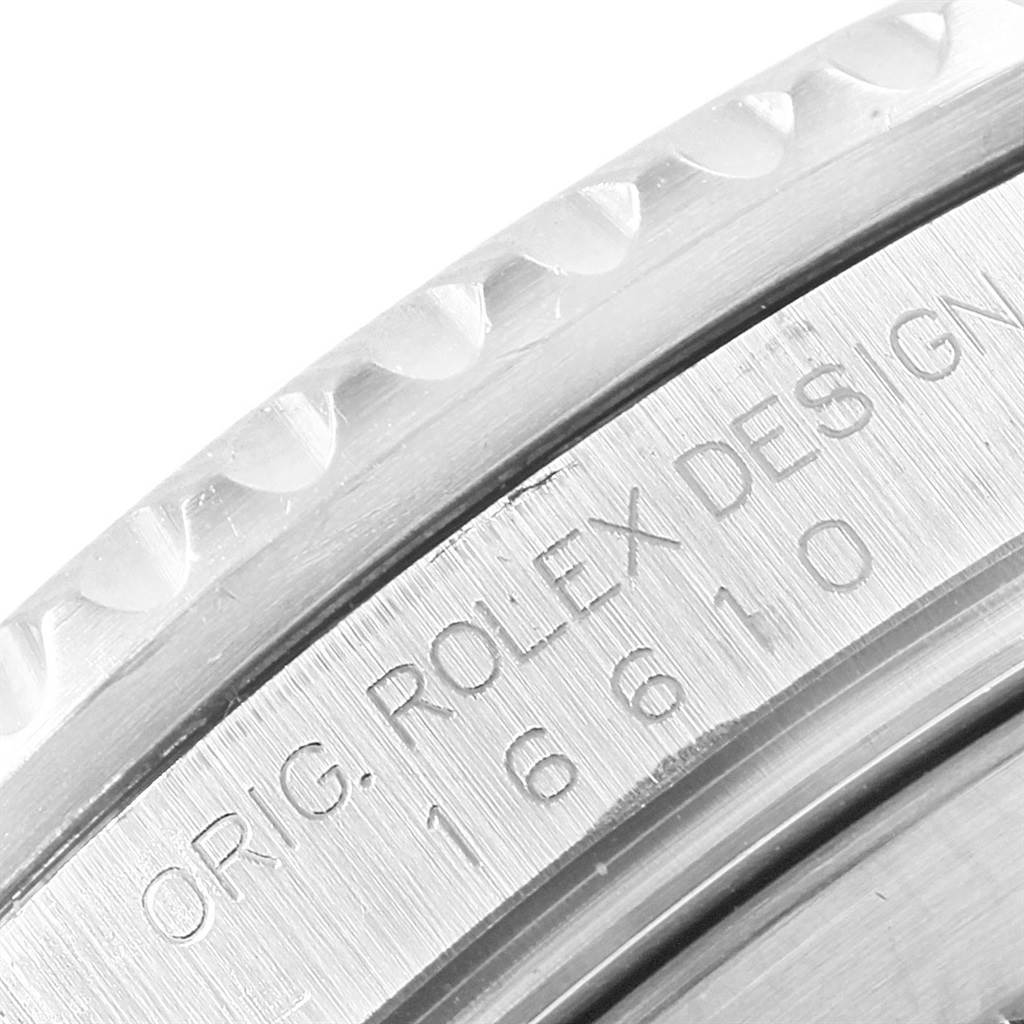 This close-up image shows the engraved case side of a Rolex Submariner 16610 Men's Stainless Steel Black Dial 16610 Men's Stainless Steel Black Dial, displaying the model number and branding text.