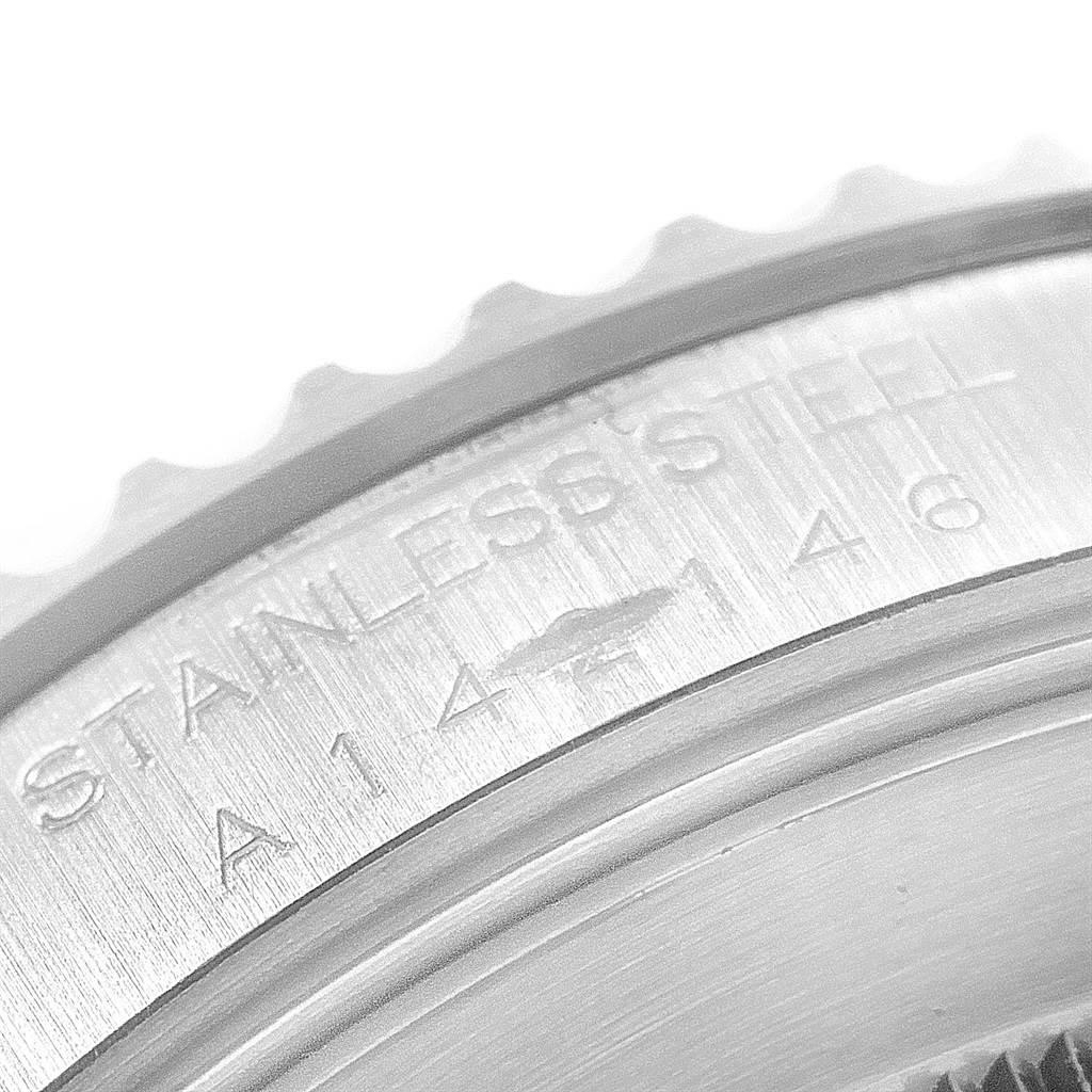 This image shows a close-up angle of the Rolex Submariner 14060 Men's Stainless Steel Black Dial 14060 Men's Stainless Steel Black Dial watch, focusing on the engraved "Stainless Steel" inscription.