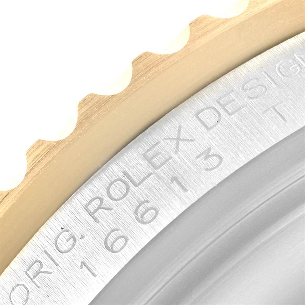 The image shows a close-up view of the bezel and case of a Rolex Submariner 16613 Men's Steel and Gold (two tone) Blue Dial 16613 Men's Steel and Gold (two tone) Blue Dial, highlighting its model number engraving.