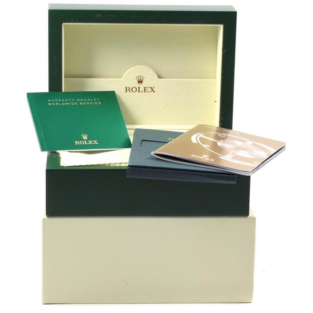 This image shows the packaging, warranty booklet, and manuals for a Rolex Submariner 16613 Men's Steel and Gold (two tone) Blue Dial 16613 Men's Steel and Gold (two tone) Blue Dial watch.