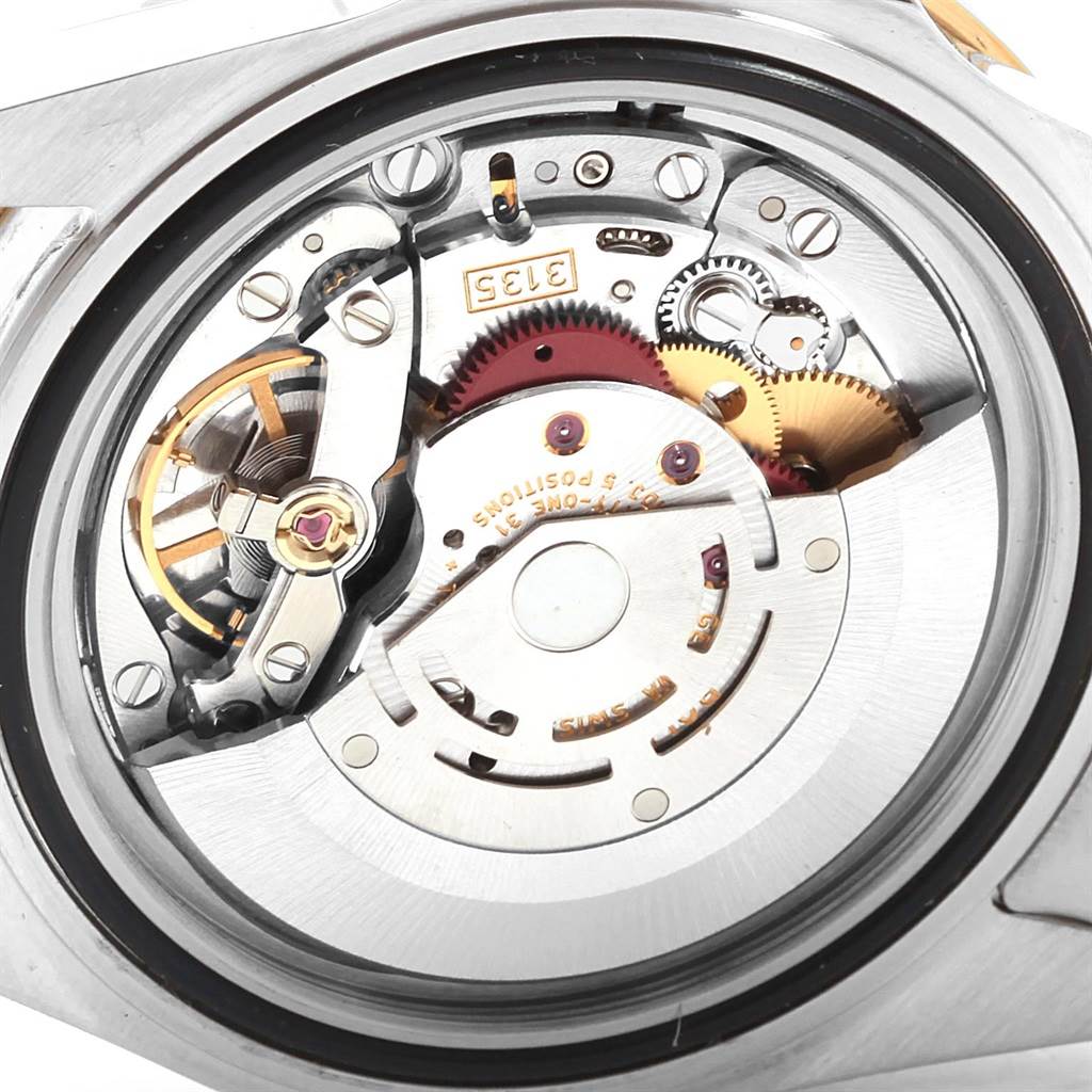 This image shows the internal mechanics of a Rolex Submariner 16613 Men's Steel and Gold (two tone) Blue Dial 16613 Men's Steel and Gold (two tone) Blue Dial watch, viewed from the back.