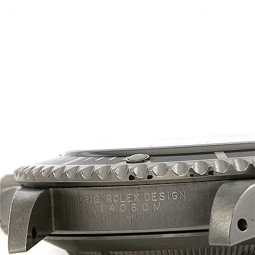 This image shows a close-up side view of the Rolex Submariner 14060 Men's Stainless Steel Black Dial 14060 Men's Stainless Steel Black Dial watch case and bezel.