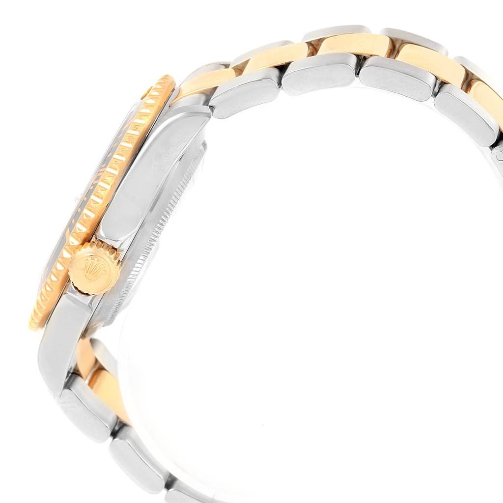 The image shows a side view of a Rolex Submariner 16613 Men's Steel and Gold (two tone) Black Dial 16613 Men's Steel and Gold (two tone) Black Dial watch, focusing on the crown, case, and part of the bracelet.