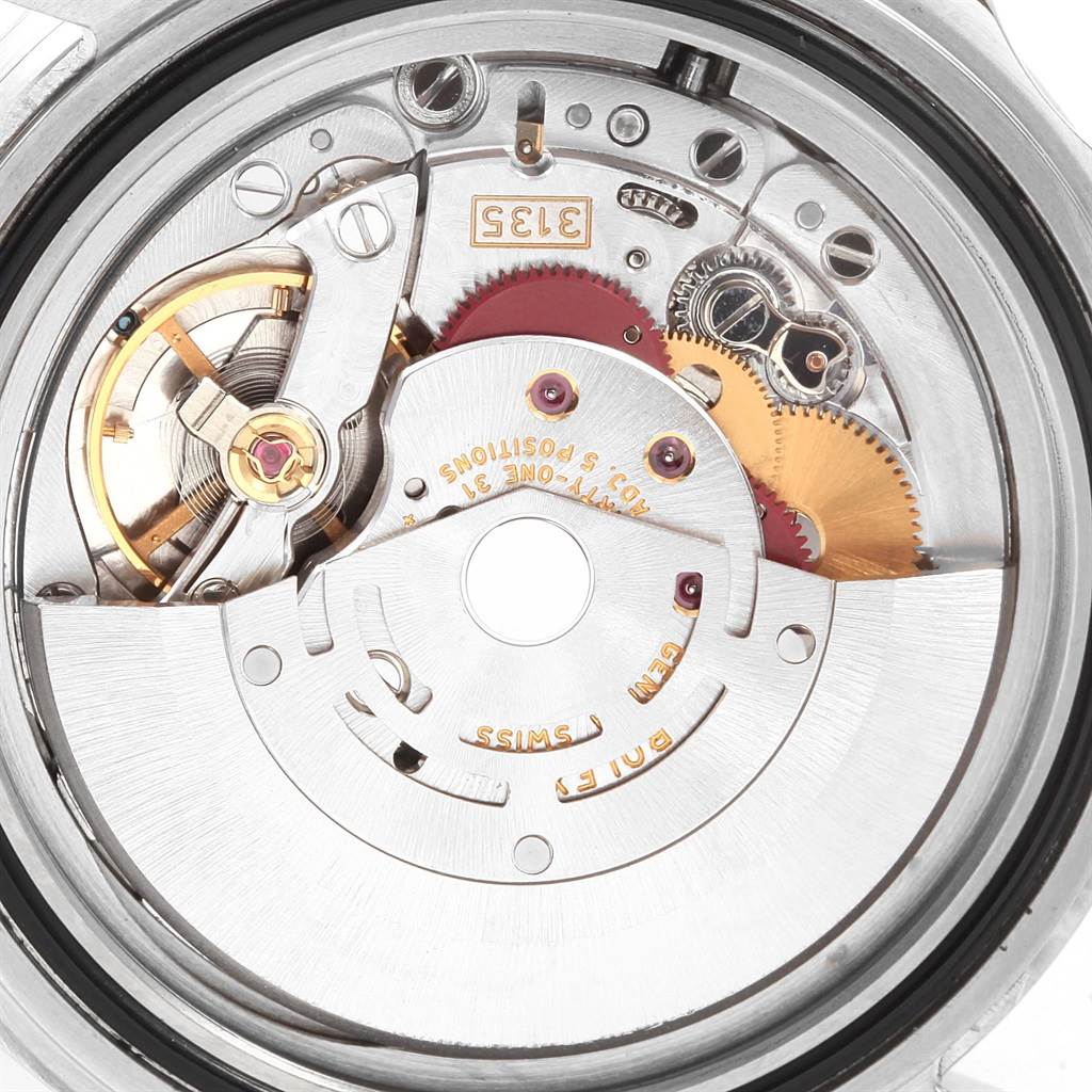 This image shows the internal mechanism of a Rolex Submariner 16610 Men's Stainless Steel Black Dial 16610 Men's Stainless Steel Black Dial watch at a close-up angle.
