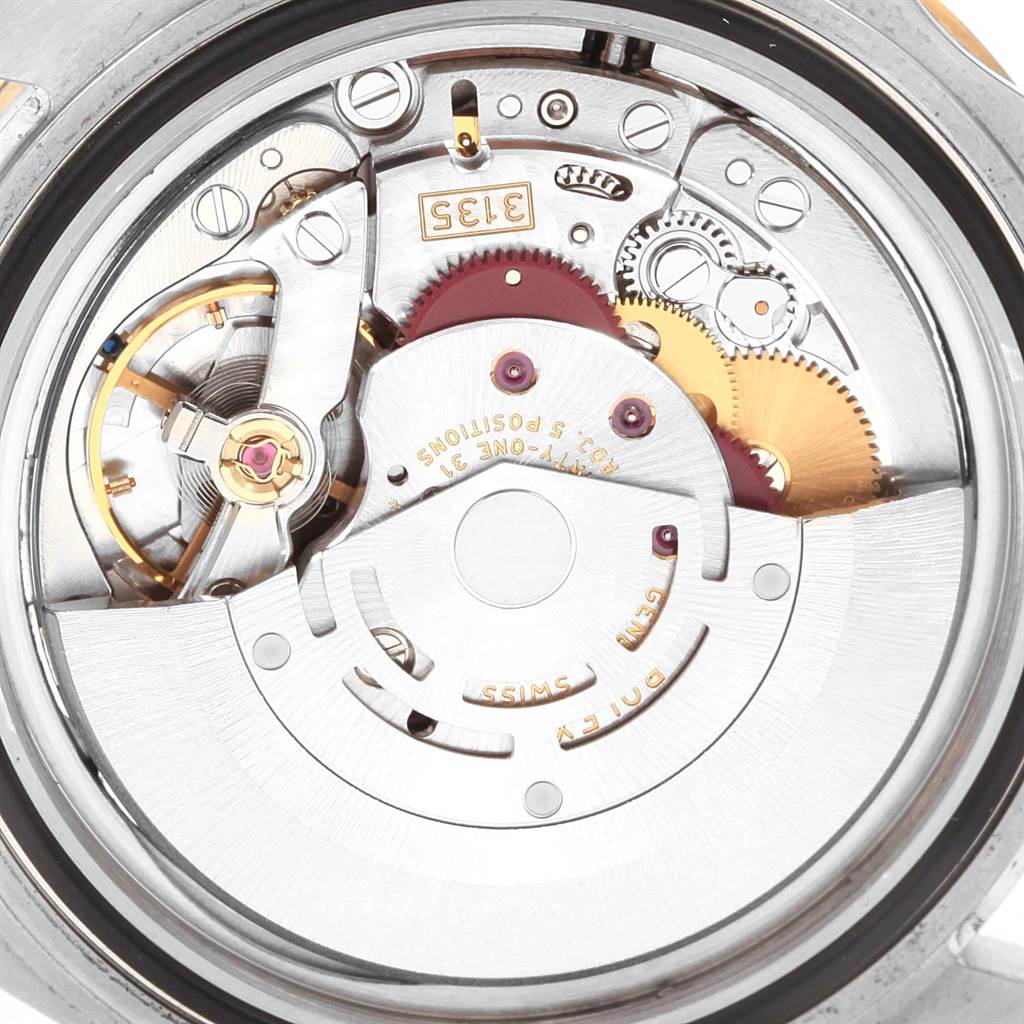 The image shows the internal mechanism of a Rolex Submariner 16613 Men's Steel and Gold (two tone) Champagne Dial 16613 Men's Steel and Gold (two tone) Champagne Dial watch from a back view angle.