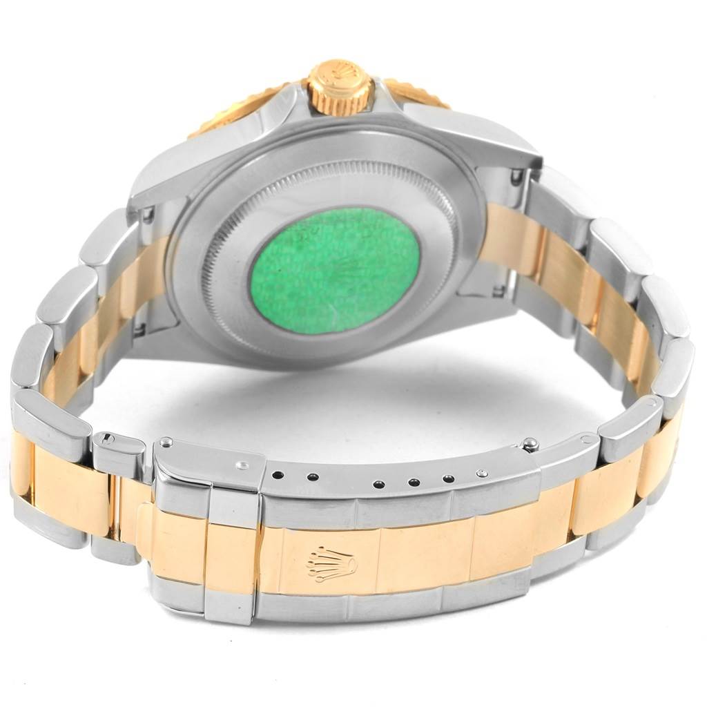 The image shows the bracelet and case back of a Rolex Submariner 16613 Men's Steel and Gold (two tone) Champagne Dial 16613 Men's Steel and Gold (two tone) Champagne Dial watch from a rear angle.