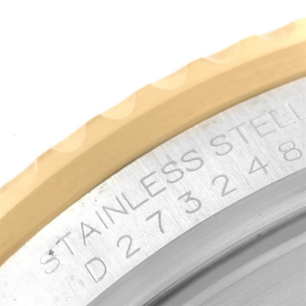 This image shows a close-up of the engraved stainless steel caseback of a Rolex Submariner 16613 Men's Steel and Gold (two tone) Champagne Dial 16613 Men's Steel and Gold (two tone) Champagne Dial watch.