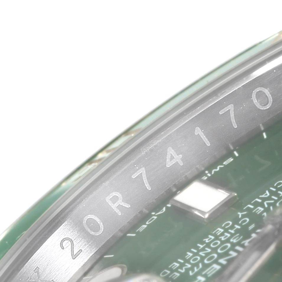 The image shows a close-up of the serial number area on the bezel ring of a Rolex Submariner 116610LV Men
s Stainless Steel Green Dial 116610LV Men
s Stainless Steel Green Dial watch.