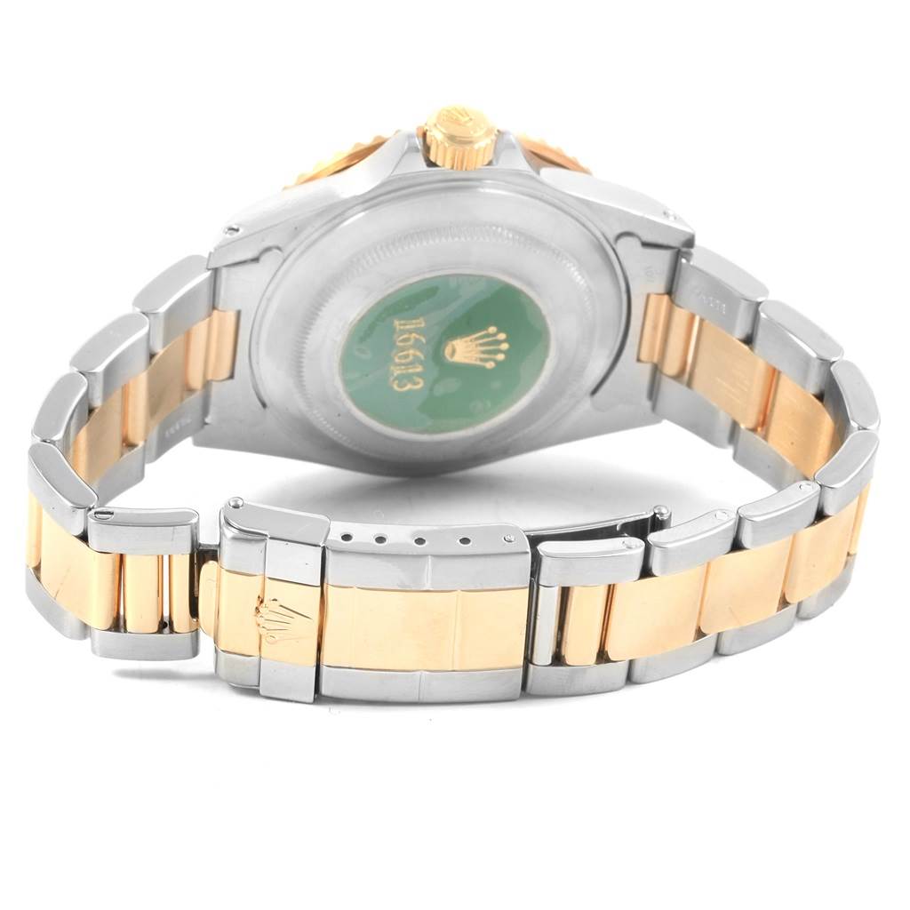 The image shows the back case and bracelet of a Rolex Submariner 16613 Men's Steel and Gold (two tone) Grey Dial 16613 Men's Steel and Gold (two tone) Grey Dial watch, highlighting the clasp and rear markings.