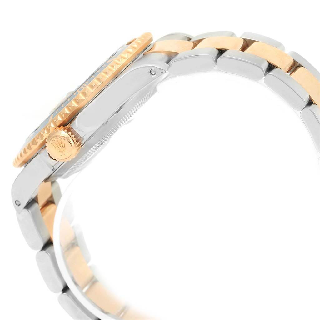 This image shows a side view of a Rolex Submariner 16613 Men's Steel and Gold (two tone) Grey Dial 16613 Men's Steel and Gold (two tone) Grey Dial watch, highlighting the bezel, crown, and part of the bracelet.