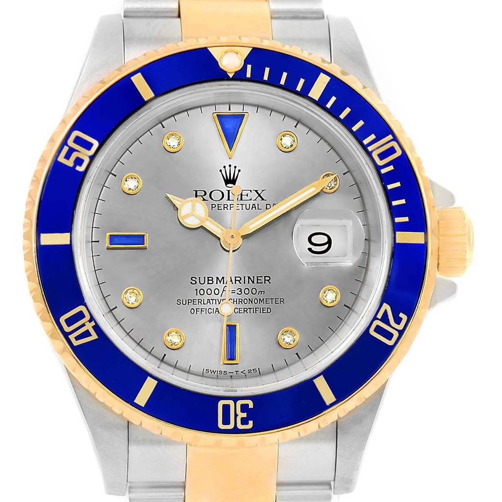 The watch is a Rolex Submariner 16613 Men's Steel and Gold (two tone) Grey Dial 16613 Men's Steel and Gold (two tone) Grey Dial, shown from a top-down angle highlighting its face, bezel, and partial bracelet.