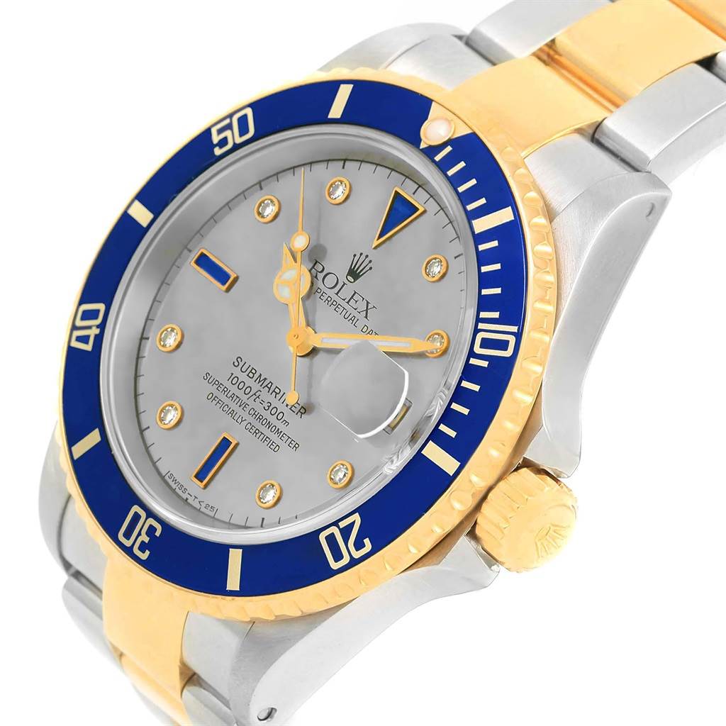 The image shows a close-up angle of the Rolex Submariner 16613 Men's Steel and Gold (two tone) Grey Dial 16613 Men's Steel and Gold (two tone) Grey Dial watch, highlighting its bezel, dial, crown, and part of the bracelet.
