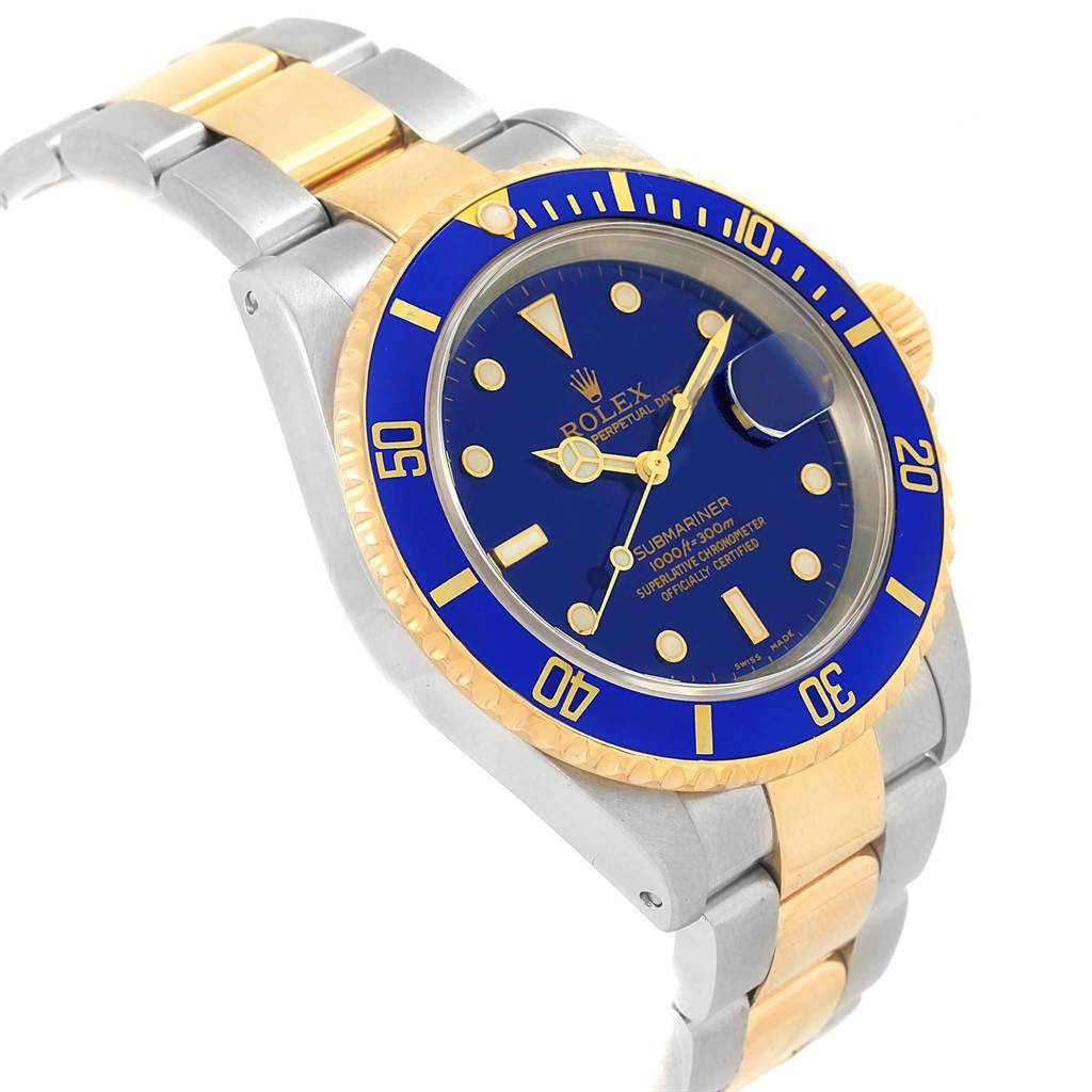 The image shows a Rolex Submariner 16613 Men's Steel and Gold (two tone) Blue Dial 16613 Men's Steel and Gold (two tone) Blue Dial model at a slight angle displaying the watch face, bezel, and part of the bracelet.
