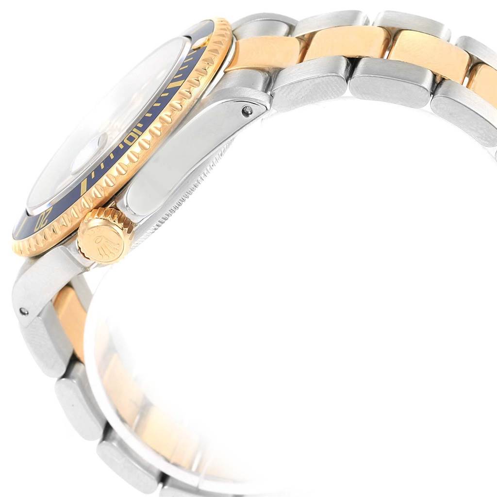 The image shows a side view angle of a Rolex Submariner 16613 Men's Steel and Gold (two tone) Blue Dial 16613 Men's Steel and Gold (two tone) Blue Dial, highlighting the bezel, crown, and bracelet.