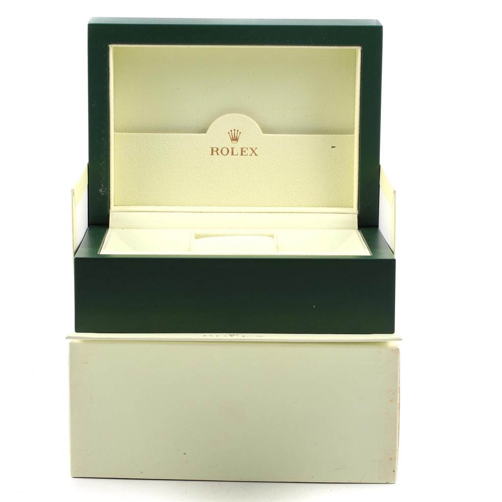 The image shows an open green and cream Rolex watch box for the Submariner model, viewed from the front.