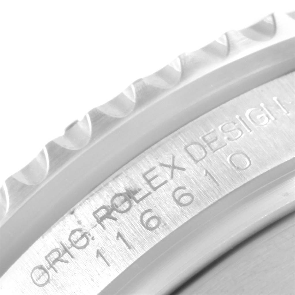 The image shows a close-up of the bezel and engraved case of a Rolex Submariner 116610LV Men's Stainless Steel Green Dial 116610LV Men's Stainless Steel Green Dial model.