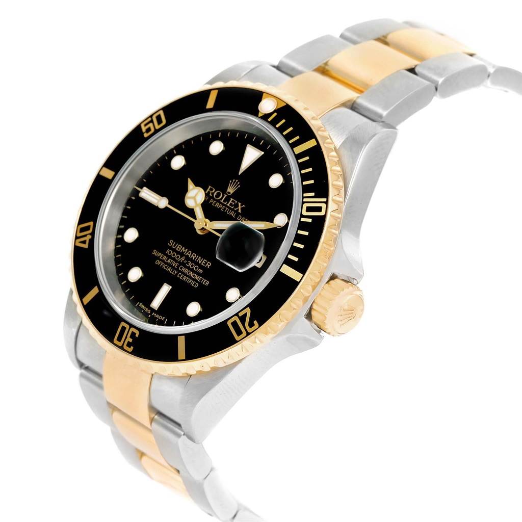 The image shows a Rolex Submariner 16613 Men's Steel and Gold (two tone) Black Dial 16613 Men's Steel and Gold (two tone) Black Dial from an angled view, highlighting the black dial, bezel, and two-tone metal bracelet.