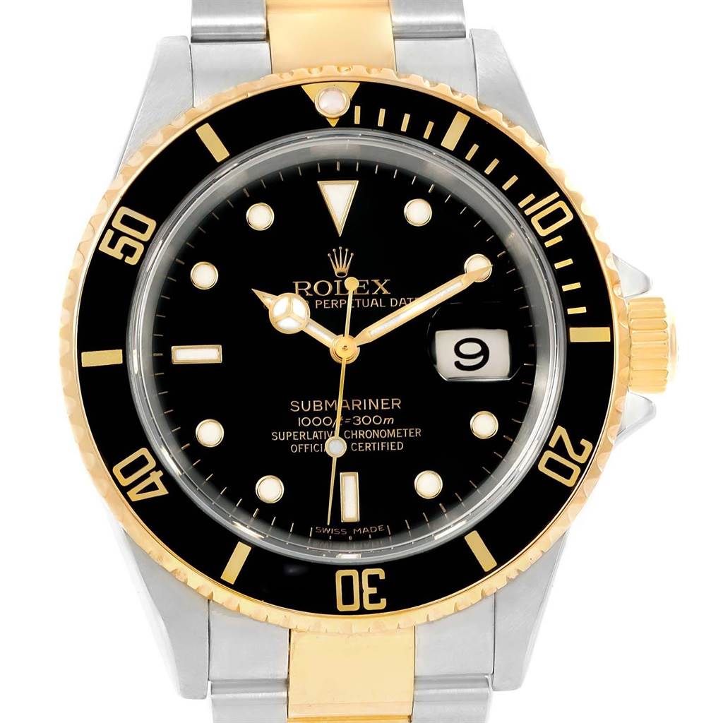 The image shows a front view of a Rolex Submariner 16613 Men's Steel and Gold (two tone) Black Dial 16613 Men's Steel and Gold (two tone) Black Dial watch, featuring its black dial, date display, bezel, and stainless steel and gold bracelet.