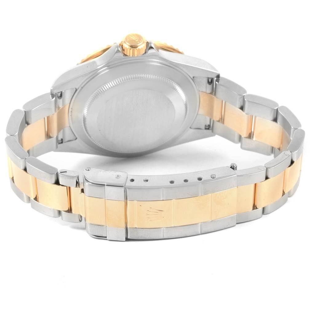 This image shows the back and band of a Rolex Submariner 16613 Men's Steel and Gold (two tone) Black Dial 16613 Men's Steel and Gold (two tone) Black Dial watch at an angle displaying the clasp, screw-down case back, and crown.