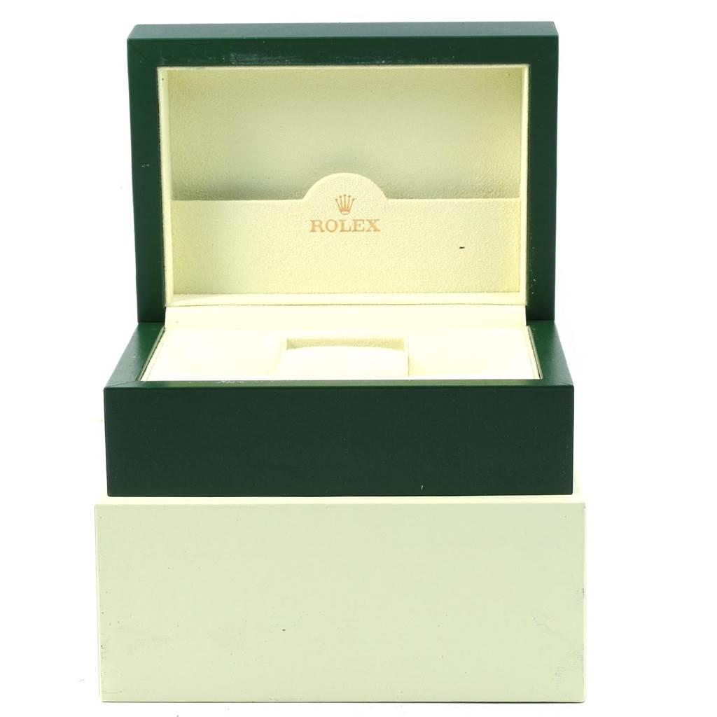 The image shows an open Rolex Submariner 16613 Men's Steel and Gold (two tone) Black Dial 16613 Men's Steel and Gold (two tone) Black Dial watch box, highlighting its green exterior and cream interior with the Rolex logo.