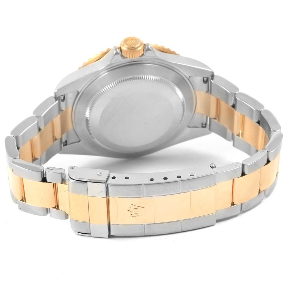 The image shows the back case, bracelet, and clasp of a Rolex Submariner 16613 Men's Steel and Gold (two tone) Grey Dial 16613 Men's Steel and Gold (two tone) Grey Dial watch at a rear angle.