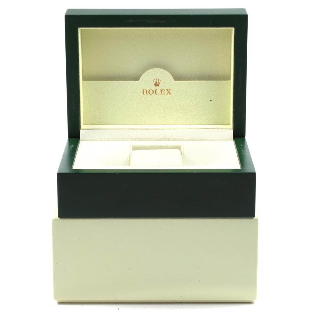 The image shows an open Rolex Submariner 16613 Men's Steel and Gold (two tone) Grey Dial 16613 Men's Steel and Gold (two tone) Grey Dial watch box with a green exterior and a cream interior.