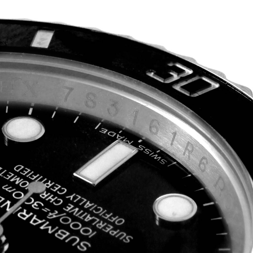 This close-up angle shows the Rolex Submariner 116610 Men's Stainless Steel Black Dial 116610 Men's Stainless Steel Black Dial's dial and bezel, highlighting the 30-minute mark and part of the text.